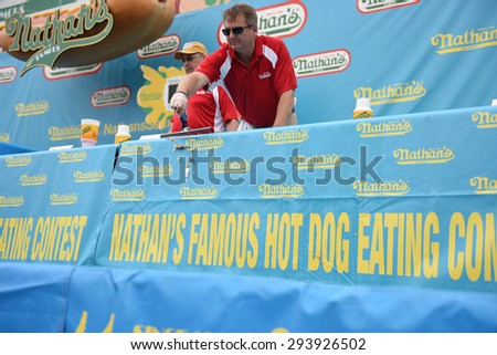 NEW YORK CITY - JULY 4 2015: Nathan\'s Famous staged their annual fourth of July hot dog eating contest in Coney Island, Brooklyn. Nathan\'s Famous staff cleans tables after contest