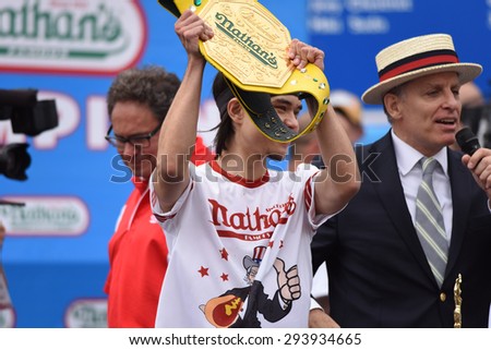 NEW YORK CITY - JULY 4 2015: Nathan\'s Famous held its annual fourth of July hot dog eating contest in Coney Island, Brooklyn. Winner Matt Stonie with mustard yellow belt