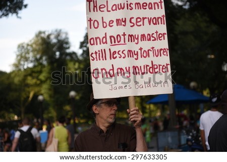 NEW YORK CITY - JULY 17 2015: Million March NYC staged a rally at Columbus Circle & march to commemorate the one year anniversary of Eric Garner's death. Several arrests ensued