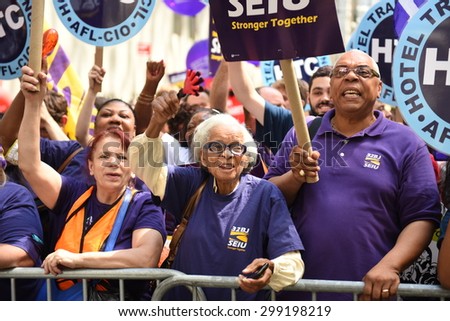 NEW YORK CITY - JULY 12 2015: organized labor, fast food workers & elected officials gathered on Barclay St. to celebrate the NY wage board\'s recommendation for a $15/hr minimum wage statewide by 2021