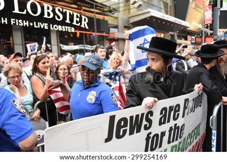 NEW YORK CITY - JULY 22 2015: thousands rallied in Times Square to oppose the President\'s proposed nuclear deal with Iran. Rally attendees angrily denounce Neturei Karta\'s anti-zionist stance