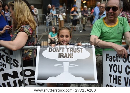 NEW YORK CITY - JULY 22 2015: thousands rallied in Times Square to oppose the President\'s proposed nuclear deal with Iran. Young activists with anti-Iran signs