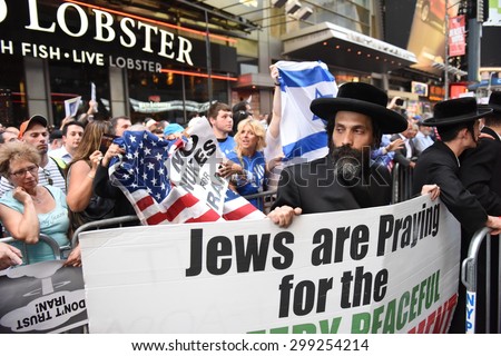 NEW YORK CITY - JULY 22 2015: thousands rallied in Times Square to oppose the President\'s proposed nuclear deal with Iran. Rally attendees angrily denounce Neturei Karta\'s anti-zionist stance