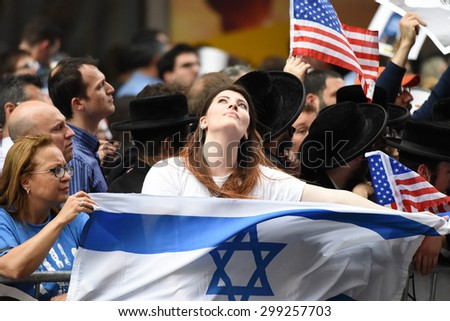 NEW YORK CITY - JULY 22 2015: thousands rallied in Times Square to oppose the President's proposed nuclear deal with Iran. Woman with Israeli flag