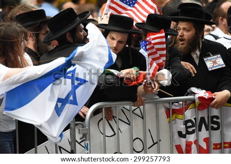 NEW YORK CITY - JULY 22 2015: thousands rallied in Times Square to oppose the President\'s proposed nuclear deal with Iran. Anti-zionist activists Neturei Karta members
