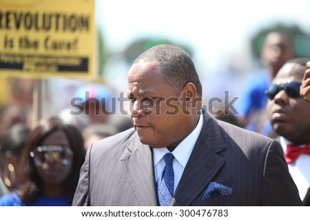 NEWARK, NEW JERSEY - JULY 25 2015: More than one thousand activists gathered for a rally & march against police brutality.  Minister Abdul Hafeez Muhammad of the Nation of Islam
