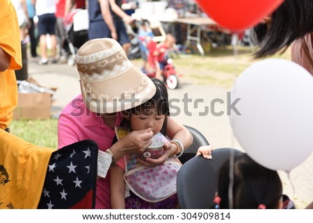 NEW YORK CITY - AUGUST 8 2015: the 25th annual Hong Kong Dragon Boat Festival took place in Flushing Meadows Corona Park, Queens