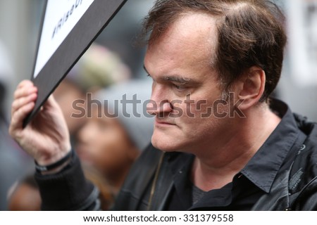NEW YORK CITY - OCTOBER 24 2015: More than one thousand activists marched on behalf of the families of victims of alleged police brutality in #RiseUpOctober. Filmmaker Quentin Tarantino
