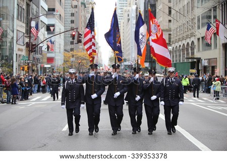 NEW YORK CITY - NOVEMBER 11 2015: New York City\'s Veterans Day was led by the US navy & grand marshal & world war two naval veteran Robert Morgenthau. FDNY  honor guard along 5th Avenue