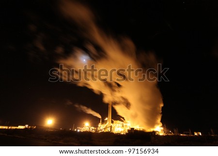 Steam Plant New Mexico/Long view of power plant off US 40 in New Mexico with lights & steam billowing into the night air.