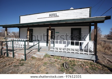 Dilapidated hotel Along Route 66/Small building with hotel sign on roof in Seligman, Arizona, although seemingly disused, it sports a proper handicapped access  ramp.