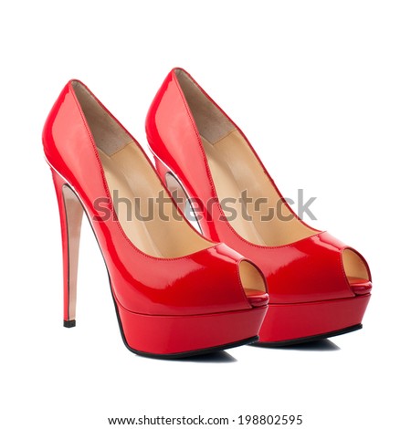 Red patent high heel women shoes isolated on white background.