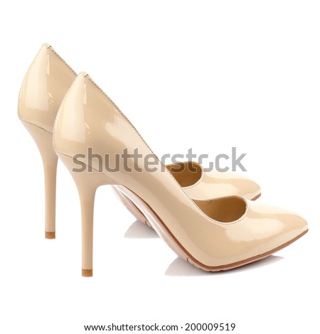 Beige patent high heel women shoe isolated on white background.