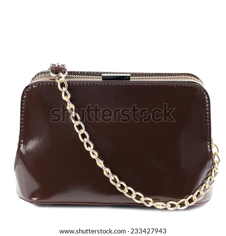 Dark brown patent clutch isolated on white background.