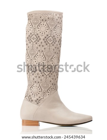 Blond knee high boot isolated on white background.