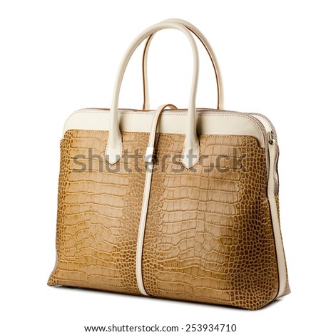 Sandy brown female handbag isolated on white background.