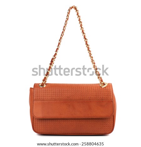 Burnt orange patent clutch isolated on white background.