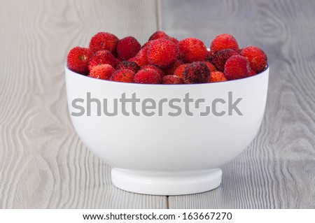 Fruits of strawberry tree in the bowl