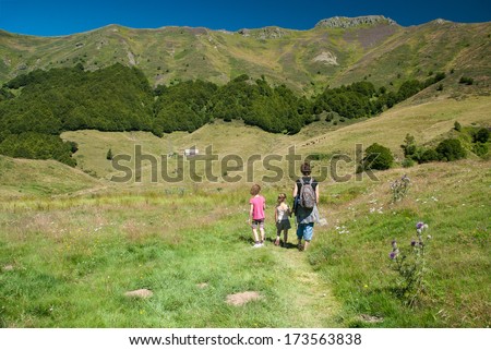 Family on a trekking day in the Auvergne mountains, Cantal, France