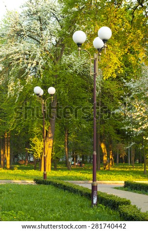 Line of lampposts along a park lane in a park
