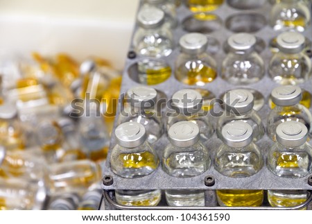 Small bottles whit yellow fluid