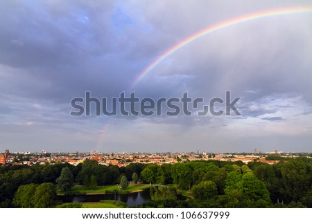Beautiful rainbow over the skyline of Amsterdam, Netherlands