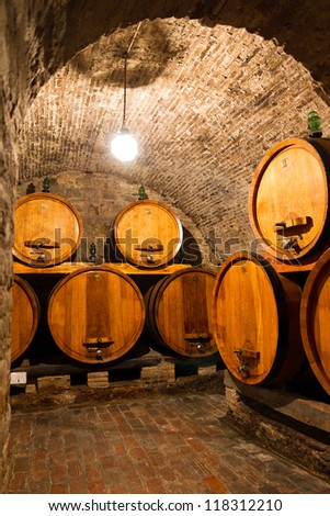 Big wooden barrels of wine in a traditional cellar in europe
