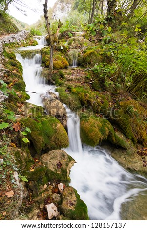 A beautiful cascade next to the path in Plitvice national park, an UNESCO world heritage site, in Croatia