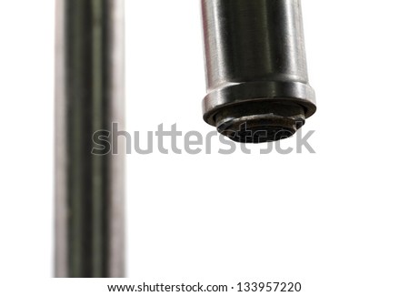 Close up minimalistic image of a water tap on a white background