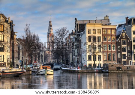 Beautiful winter view on the Groenburgwal and the Southern church in Amsterdam, the Netherlands. HDR