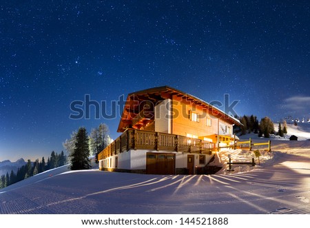 Magnificent Panorama Of A House On The Mountain With A Lot Of Stars At Night