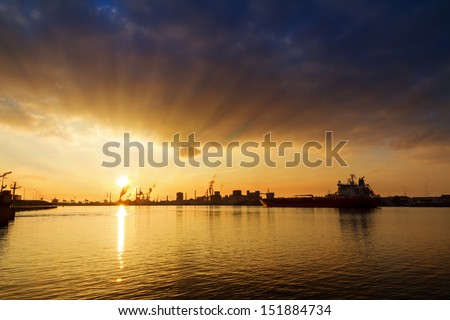 Sunset view of the heavy industry with smoking chimneys in IJmuiden, the Netherlands