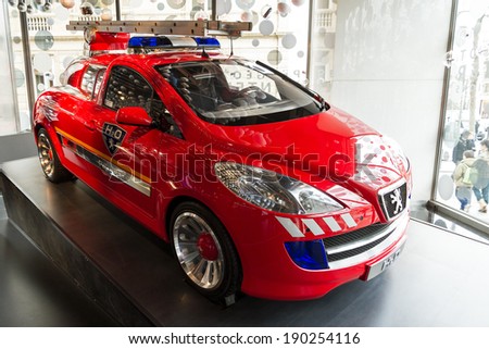 PARIS, FRANCE - FEBRUARY 20, 2014: Peugeot H2O fire engine concept car in the showroom on the Champs Elysees in Paris, France, on February 20, 2014