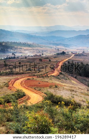 Typical view on the current landscape of Madagascar where deforestation has lead to empty red landscapes. HDR