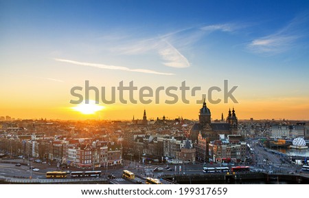 Sunset cityscape in winter of the skyline of Amsterdam, the Netherlands.
