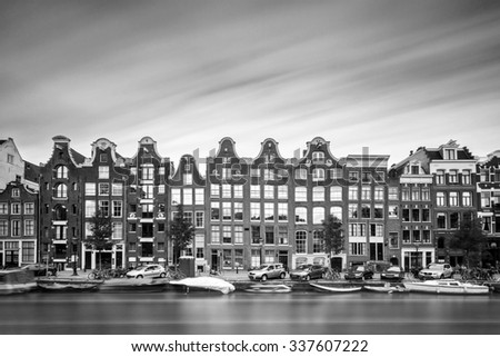 Beautiful long exposure of the canal houses at the UNESCO world heritage Prinsengracht canal in Amsterdam in black and white