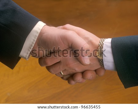 Woman and man shaking hands