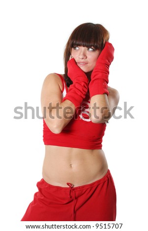 The beautiful girl dances in a red suit