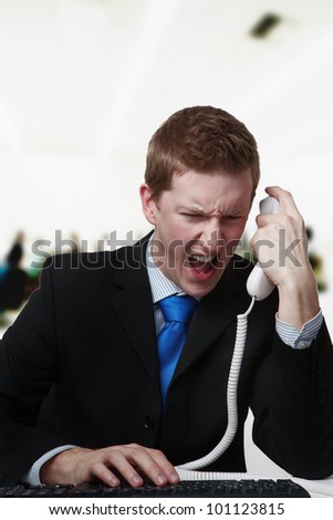 angry business man on the phone not happy about something