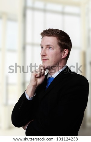 male office worker thinking about something what could it be