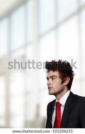 portrait of young businessman looking into camera