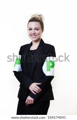 business style woman wearing P plates as arm bands