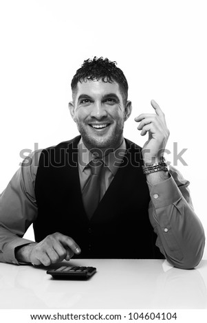 business man working at his desk adding up doing sums