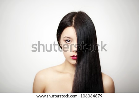 woman with long hair going down side of face