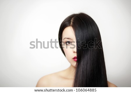 woman with long hair going down side of face