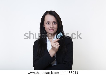 business woman holding a ticket showing you her winning number