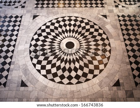 Circular mosaic black and white patterned floor