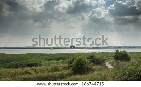 Cloudy sky over the river Thames in Purfleet, Grays, Essex