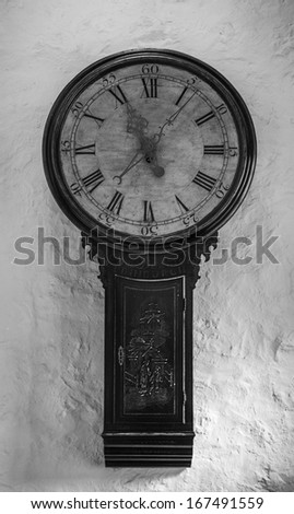 Old wall clock on white background
