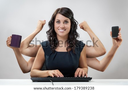 busy  business woman multitasking in the office with six arms